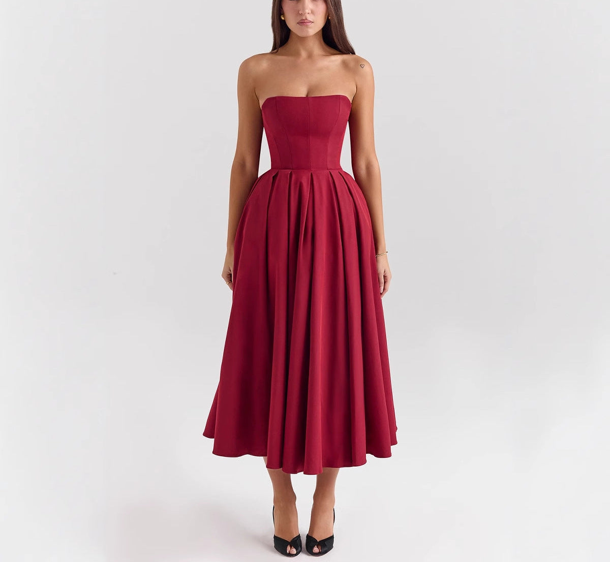 Woman wearing a strapless red dress diamond Sadaf 
